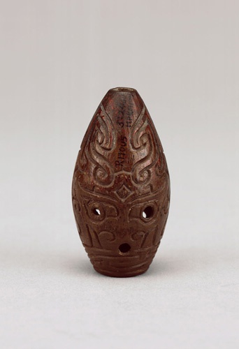 Whistle with carved animal-mask motif